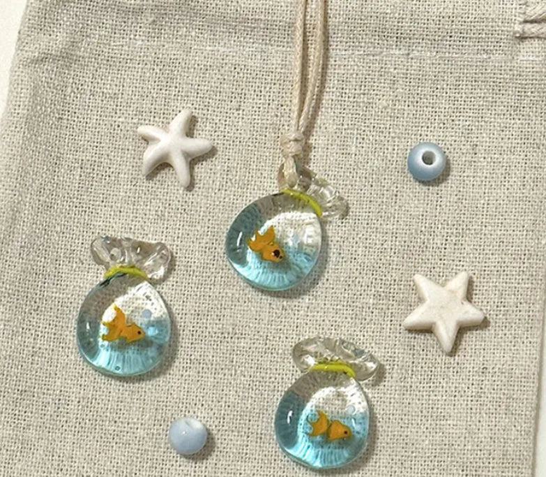 Women's necklace with a coloured glaze joker skirt pendant on a cotton and linen clavicle chain.