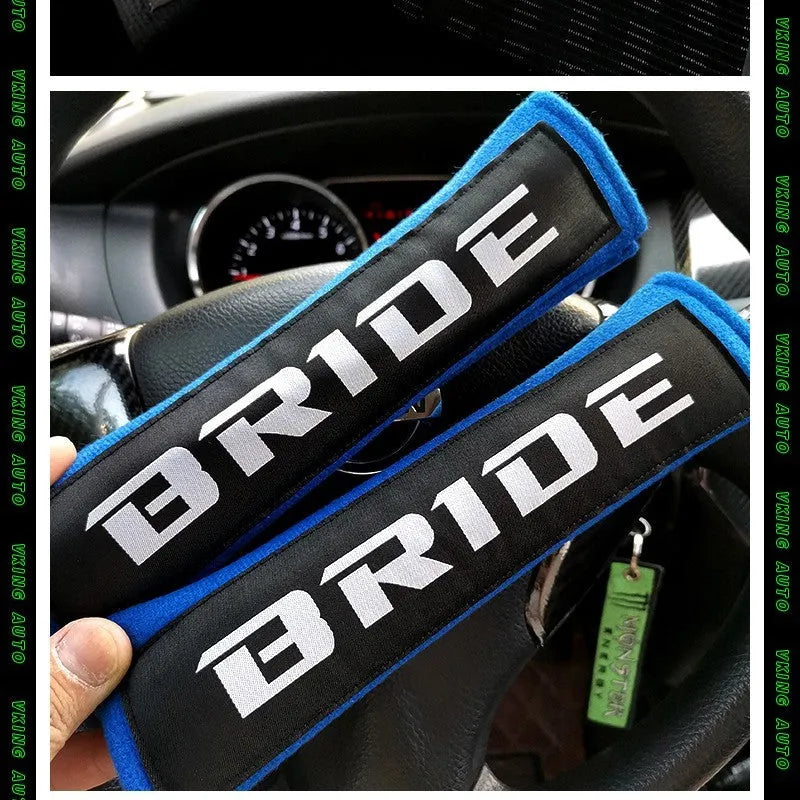 Cotton sponge cloth car seat belt shoulder pads in black, blue, and red colours, showing embroidered weaving detail.