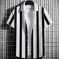 Man wearing a striped linen short-sleeve T-shirt with a 3D printed pattern.
