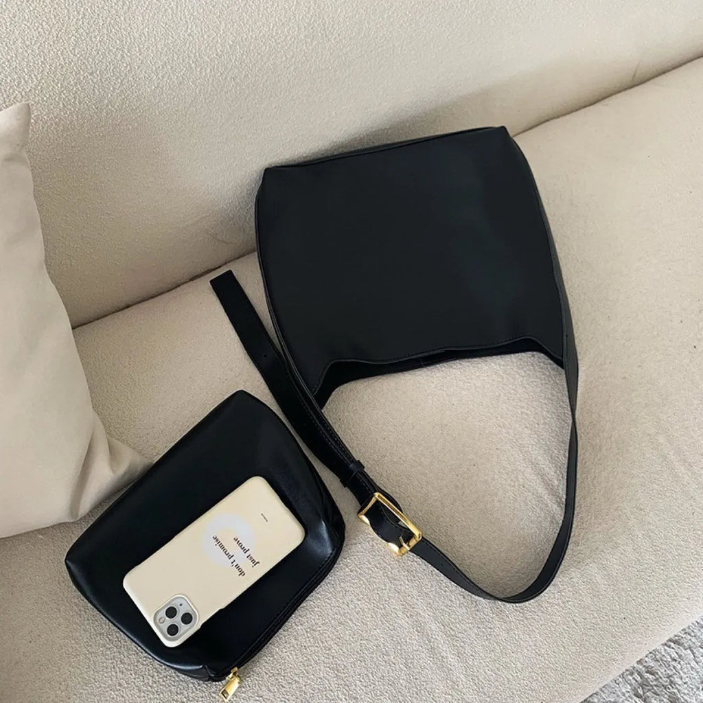 Women's soft PU leather crossbody bag with swing threads detail showing black ribbon colour option