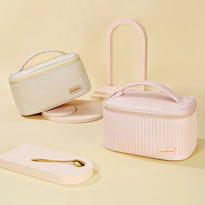 Open-top makeup bag in PU leather shown in a choice of six solid colours.