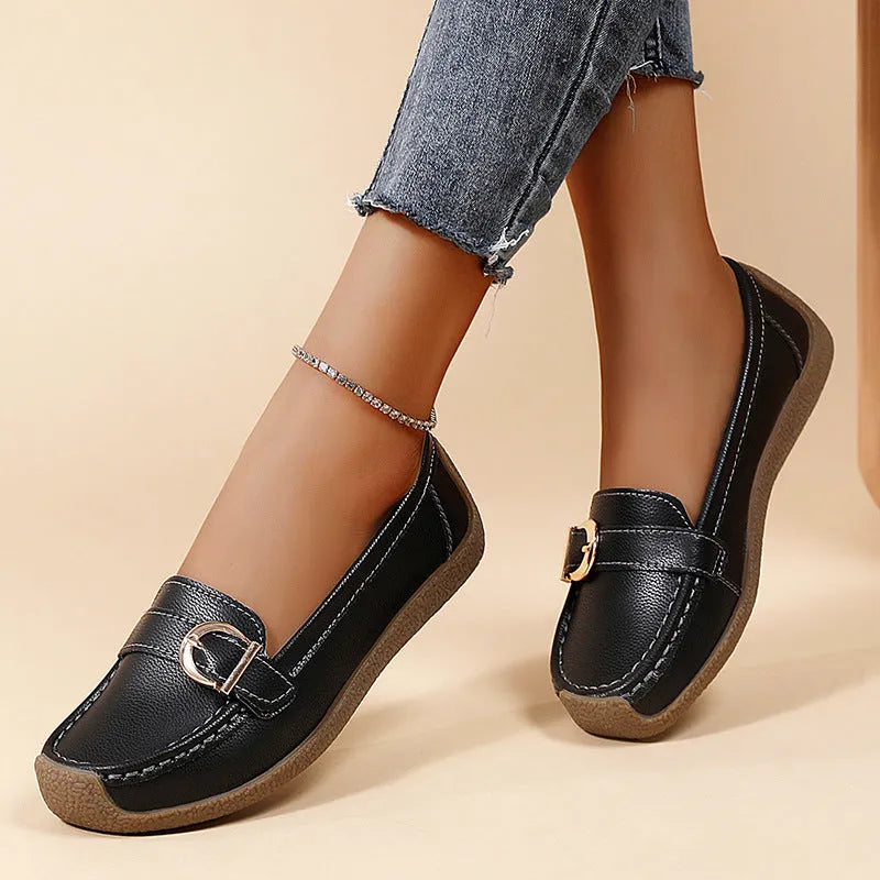 Women's casual loafers in beige with round toe, flat heel, and shallow cut opening.