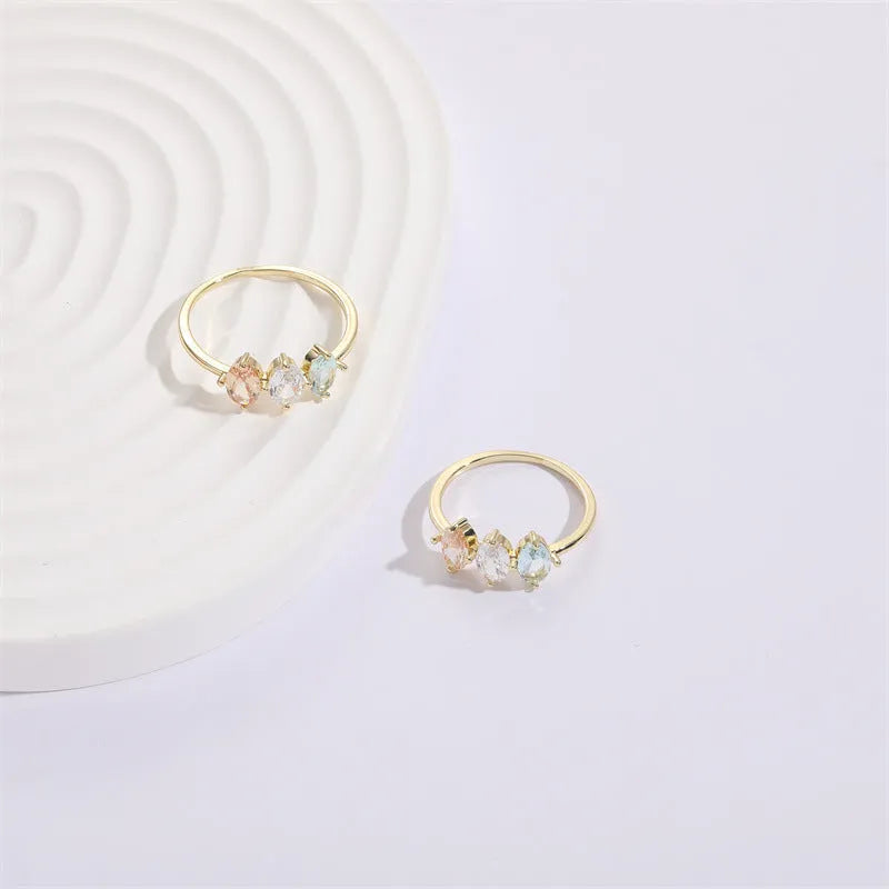 Women's Mother's Day birthstone ring with geometric triangle design and horse eye tricolor zircon stones