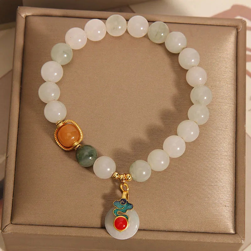 Women's ice jade bracelet with pearl accents and a jade buckle on a retro design.