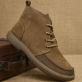 Grey genuine leather Martin boots with wedge heel and front lace-up design.