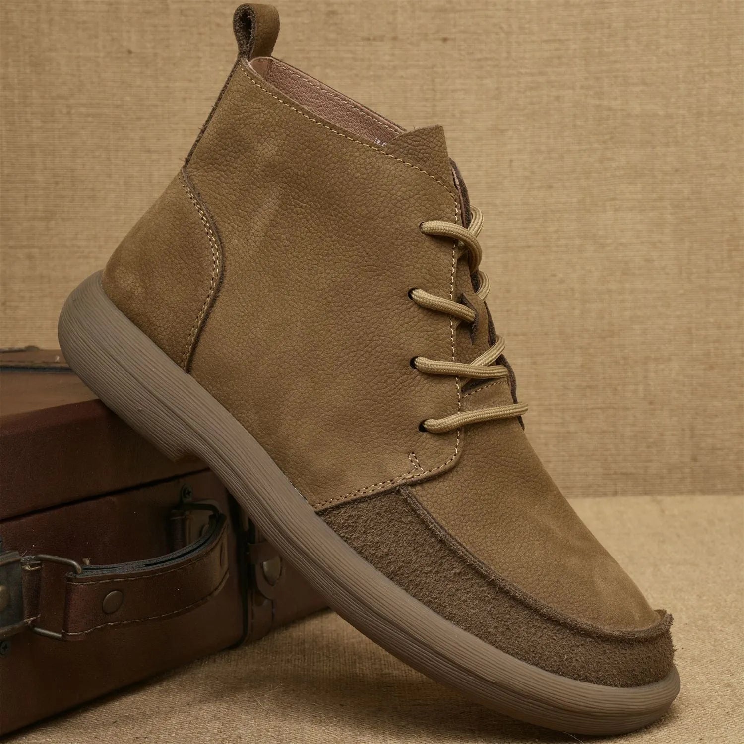 Grey genuine leather Martin boots with wedge heel and front lace-up design.