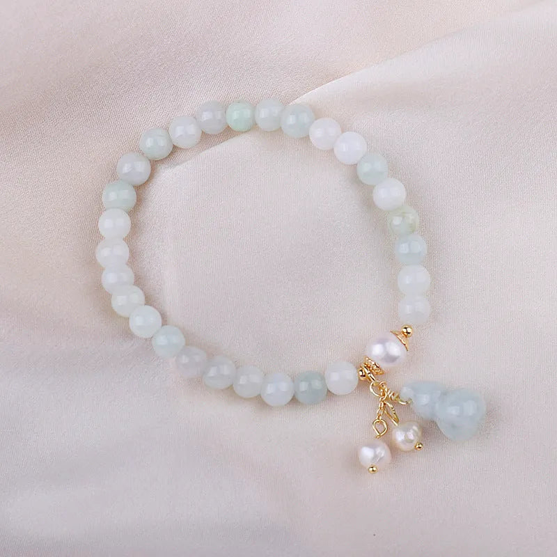 Chinese style women's jade bracelet with hand-carved emerald gourd pendant and pearl accent