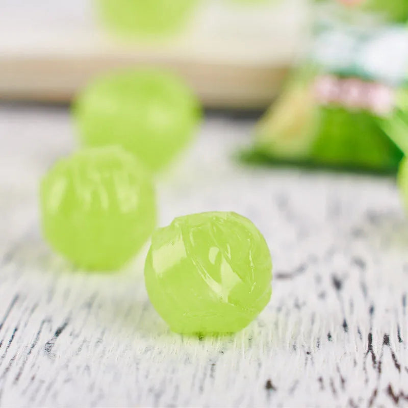 Assortment of guava, plum sugar, and tangerine peel hard candies in a gift pack bag.