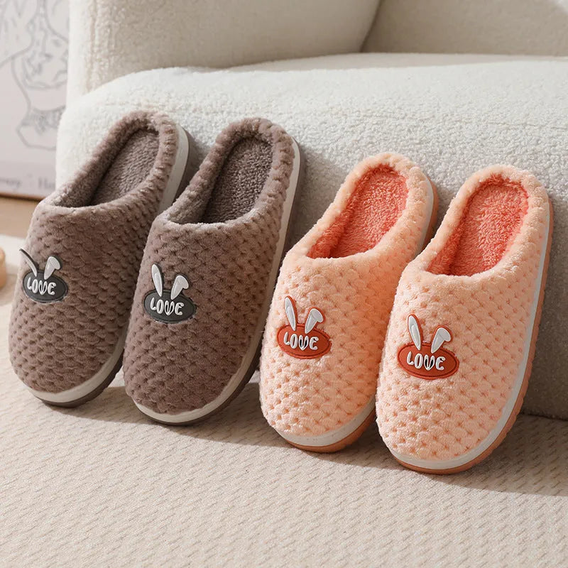 Women's plush rabbit plaid house slippers with thick rubber non-slip soles in apricot colour.