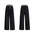 High-waisted straight-leg trousers in grey featuring a button-open line design detail on the leg.