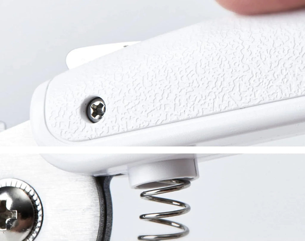 White pet nail clippers with LED light, transparent anti-splash guard, and integrated nail file on a grey background.