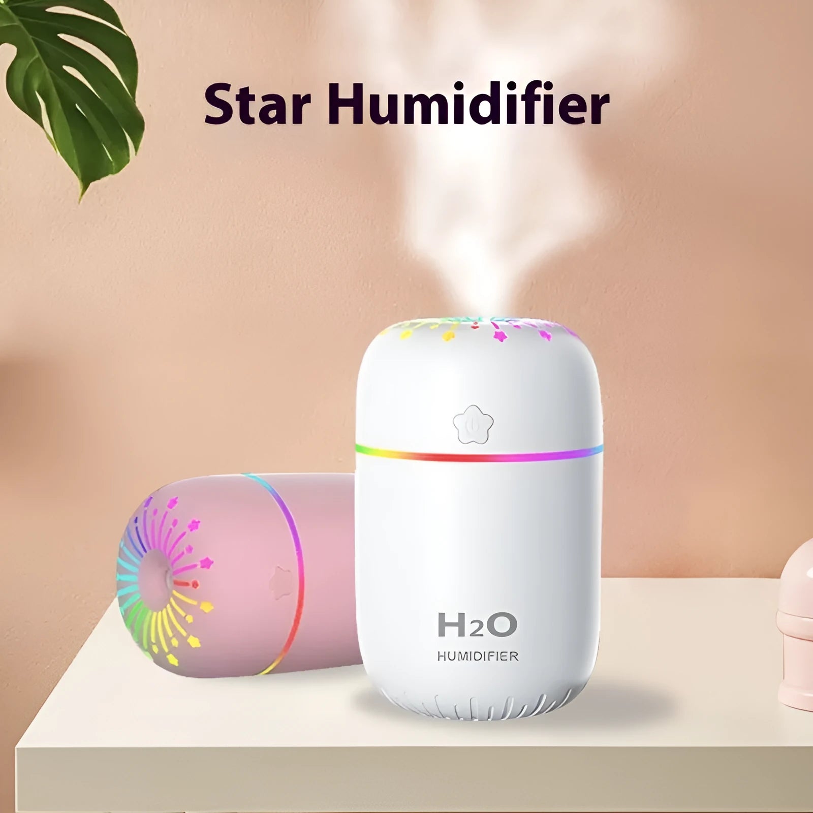 Small white, pink, or green USB-powered mini humidifier with water tank on a desk.