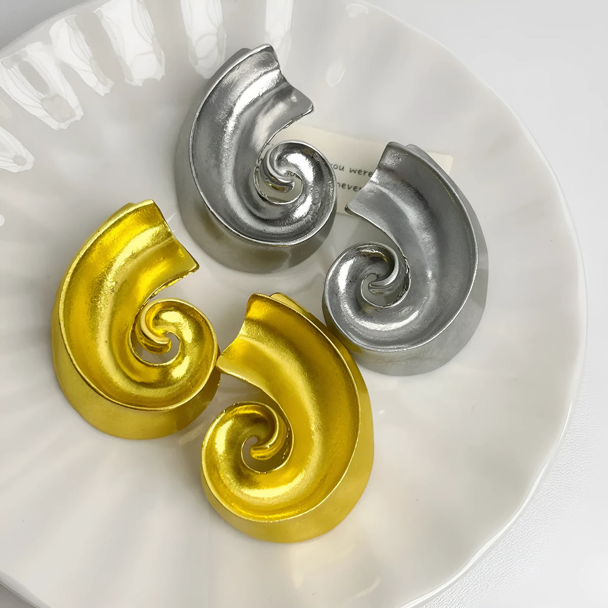Retro geometric alloy ear studs measuring 5cm in gold and silver electroplated finishes.