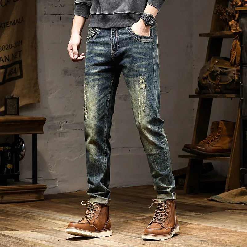 Men's retro colour skinny jeans with a zip fly, shown laid flat.