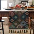 Dark blue striped table runner with fringed tassel trim laid on dining table