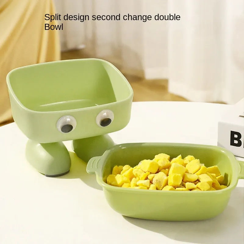 Green robot-shaped elevated cat bowl with tilted design and anti-slip base