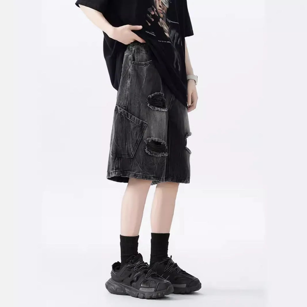 Black and Blue ripped denim shorts with a washed vintage finish and loose, retro fit.