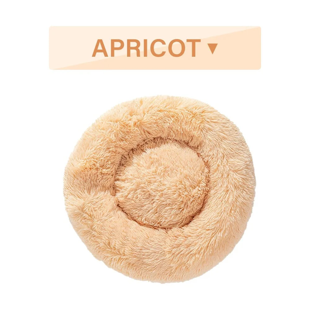 Fluffy donut-shaped dog bed in long plush fabric, showing raised rim and available colour options