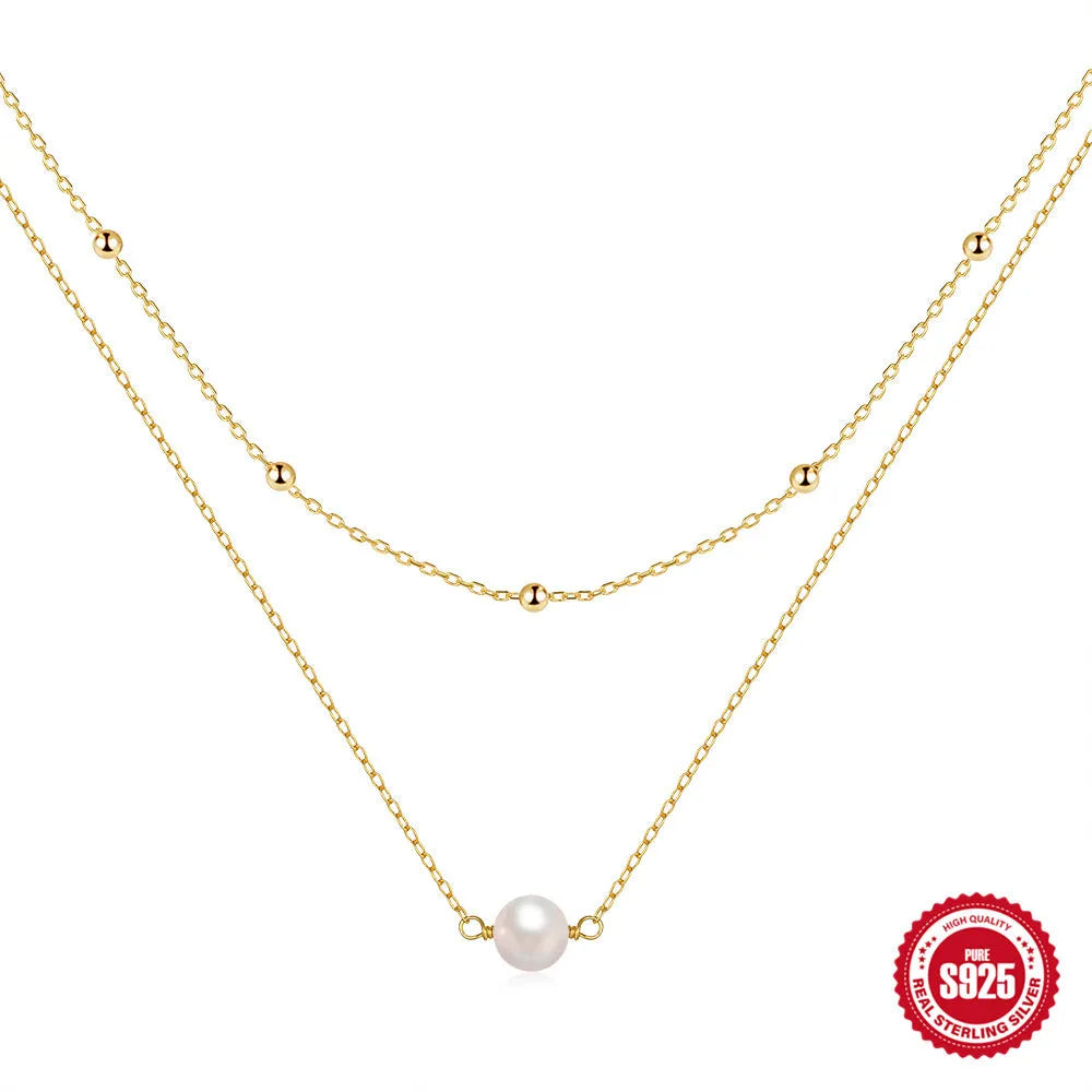 Sterling silver double layer necklace with twin pearls and geometric pendant in gold colour