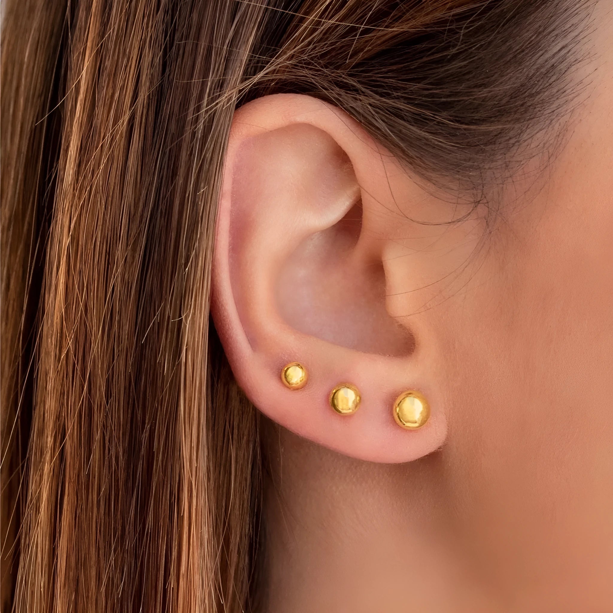 Stainless steel ball stud earrings with geometric round design and gold electroplated finish