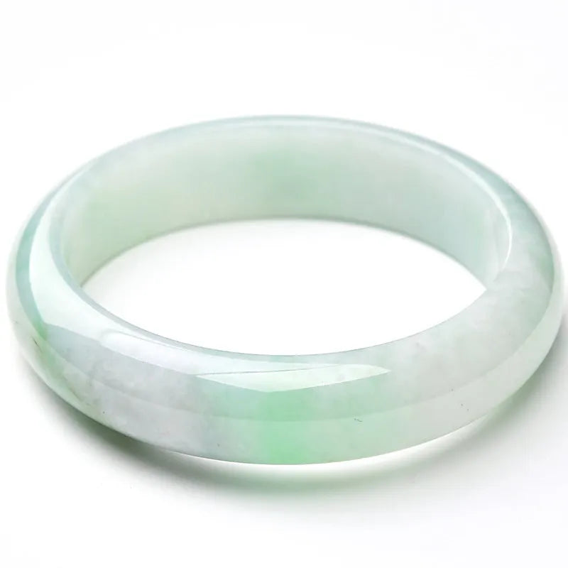 Light green jade bracelet in natural style showing simple closed-loop design