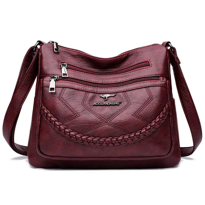 Soft black PU leather women's crossbody bag showing square shape and outer pocket