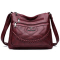 Soft black PU leather women's crossbody bag showing square shape and outer pocket