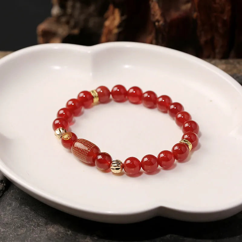 Red agate Guanyin bracelet with auspicious patterns in new Chinese style, showing Buddhist prayer beads