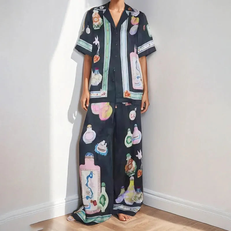 Black women's casual set with cartoon animation print showing cardigan top and matching trousers