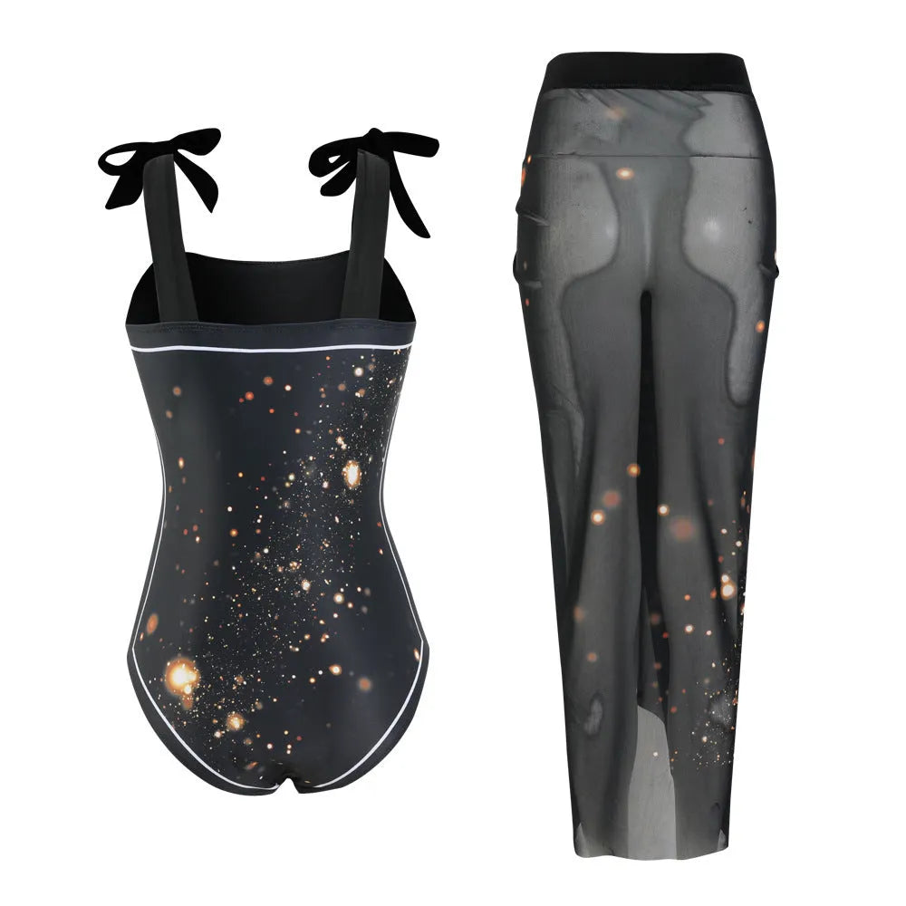 Floral print one-piece swimsuit with mesh tube top and detached skirt shown in brown.