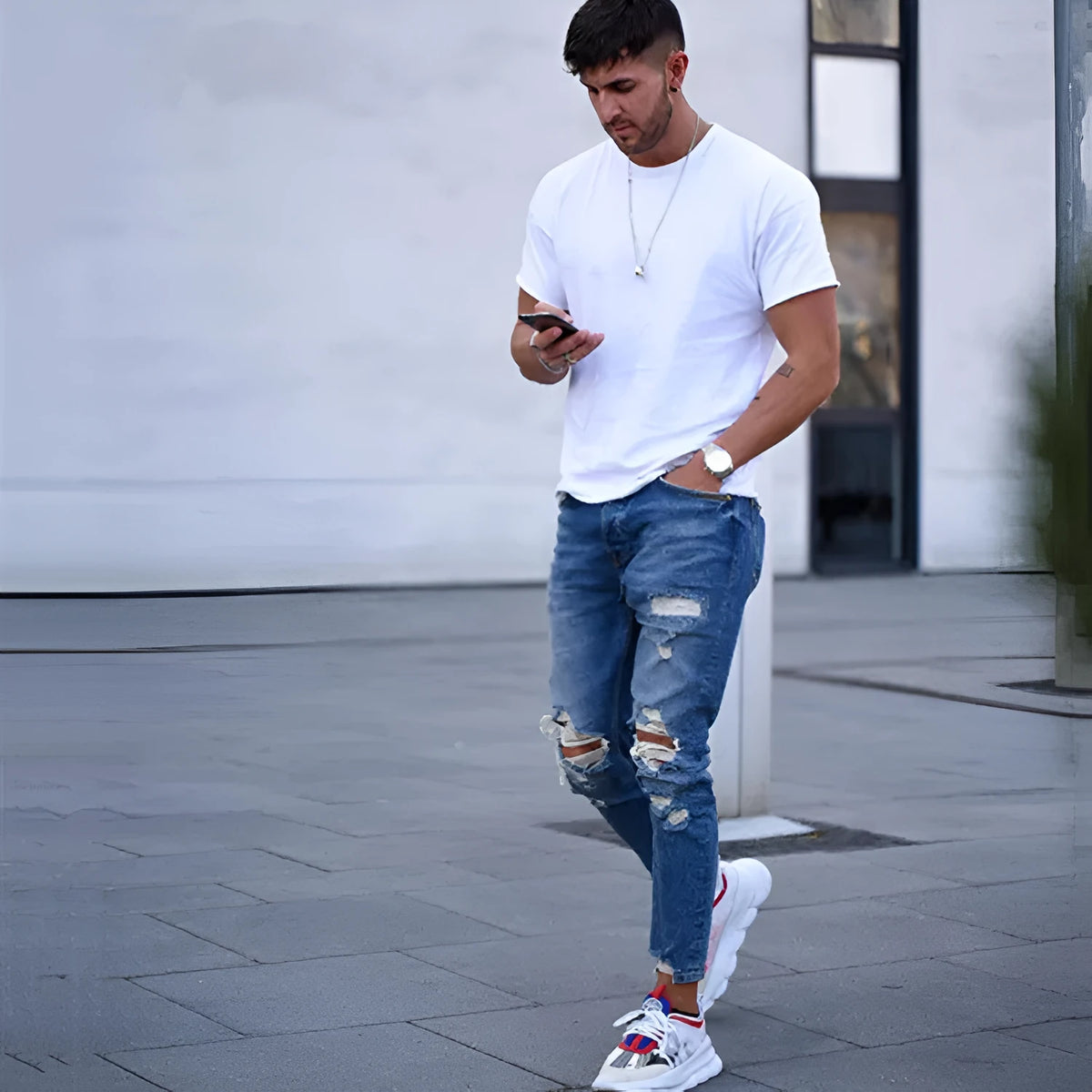 Men's deep blue cotton jeans laid flat, showing the five-pocket design and button fly.