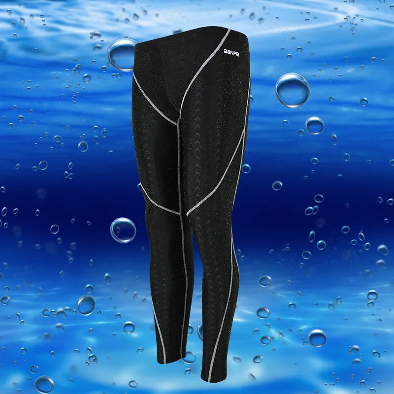 Men's nylon cropped swimming trunks in dark blue with orange line detail