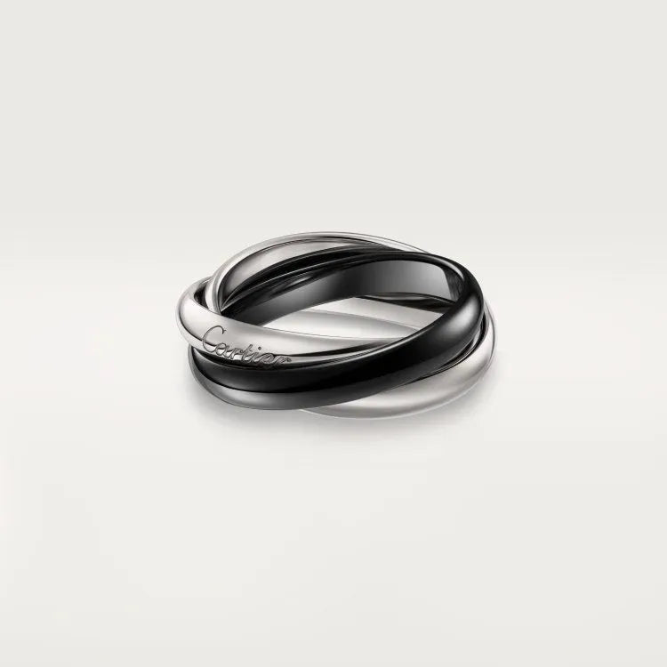 Sterling silver geometric U-shape couple ring with diamond setting on a hand.