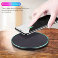Black Qi wireless charging pad for iPhone 11 with integrated USB cable