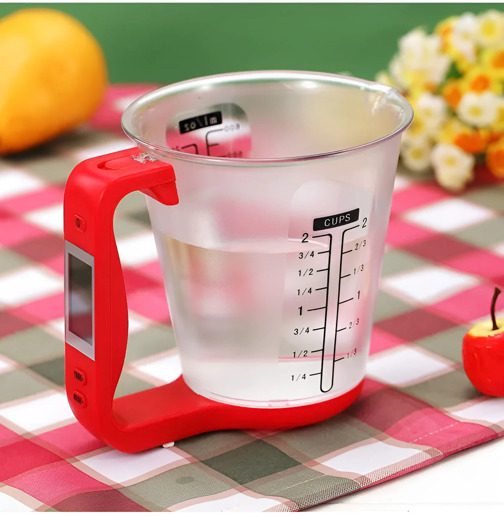 Green electronic kitchen scale measuring cup with LCD display built into handle showing weight measurement