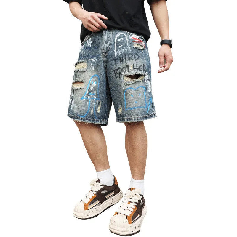 Men's blue ripped jeans shorts with graffiti detail, straight leg cut, and zipper fly closure