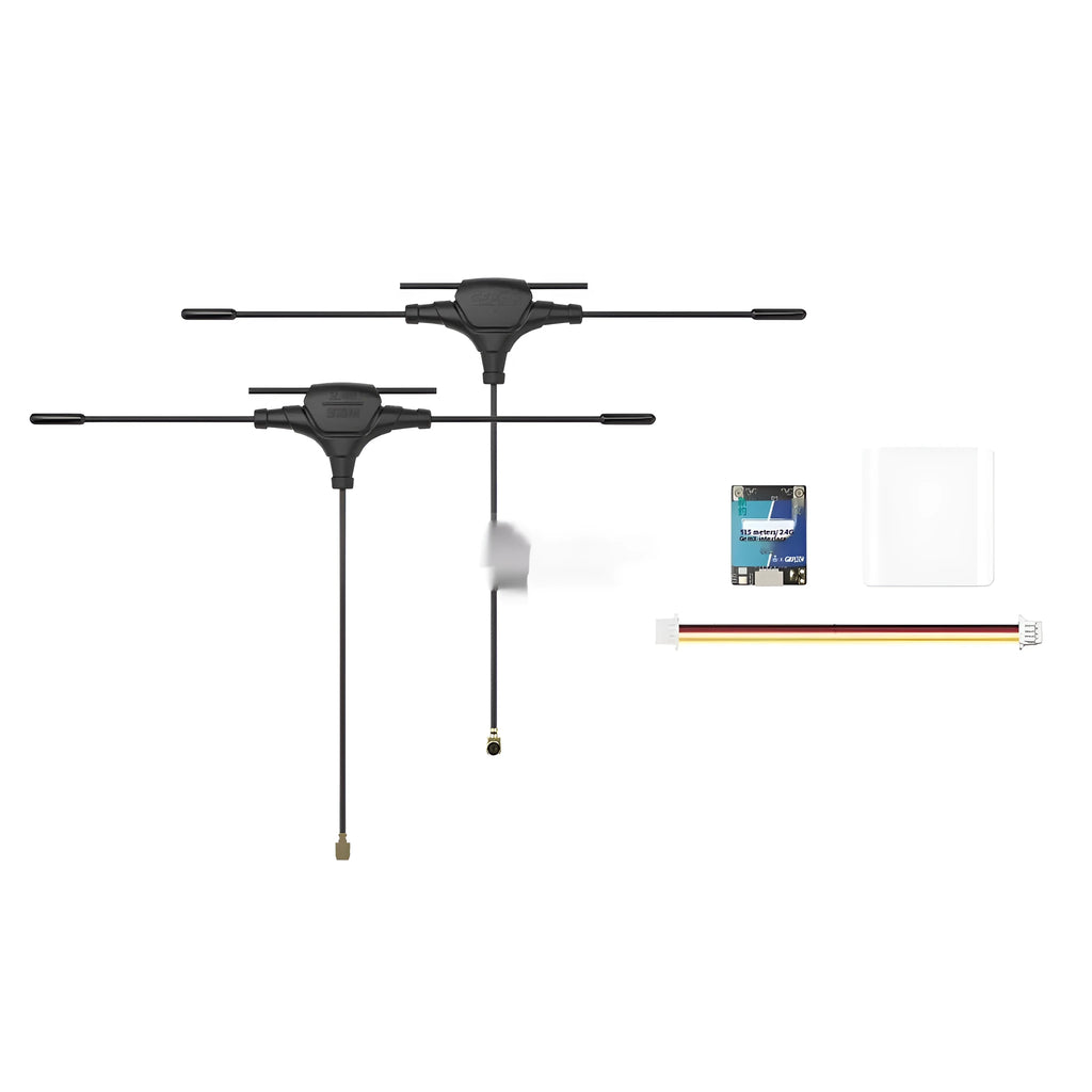 ELRS dual-band FPV receiver module with two T-shaped antennas and silicone wire on a workbench.