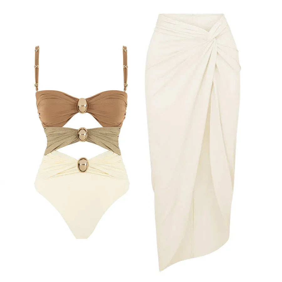 Women's solid-colour one-piece swimsuit with gold button and detachable skirt in assorted colours.