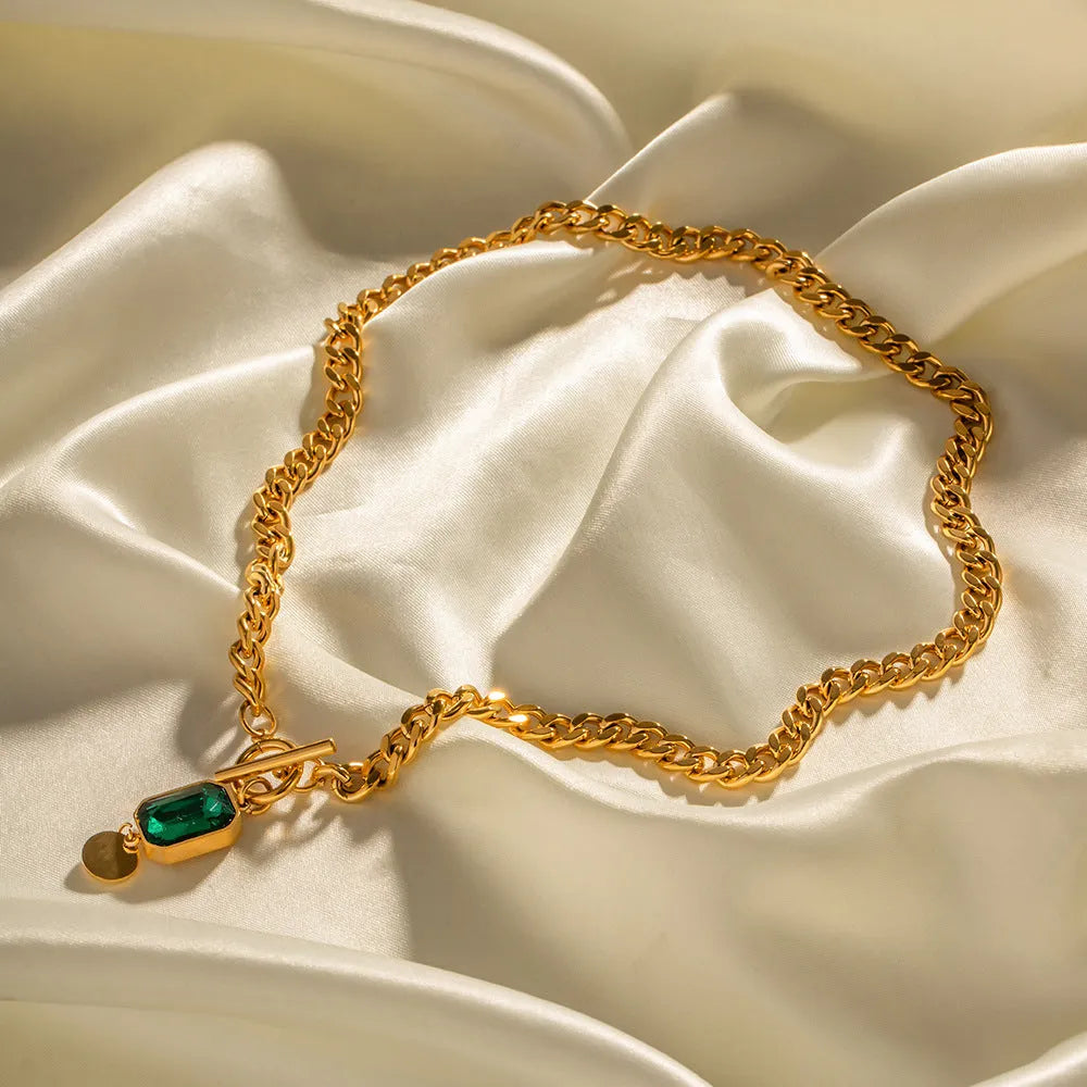 Gold retro pendant necklace with geometric round design and emerald zircon stone