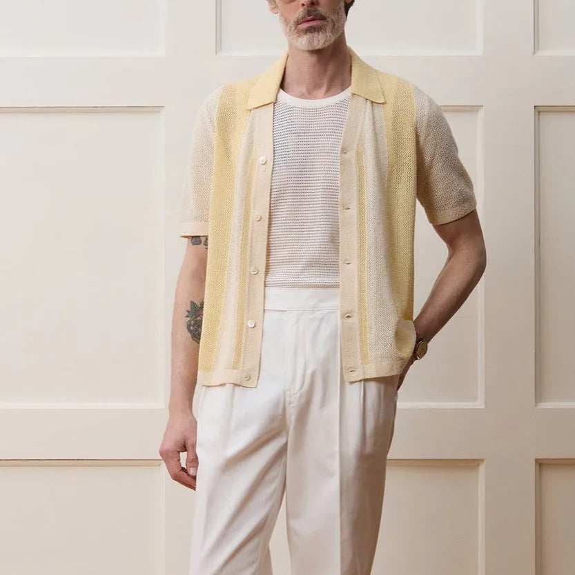 Yellow casual polo shirt with hollow-out pattern and asymmetric design detail, short sleeves