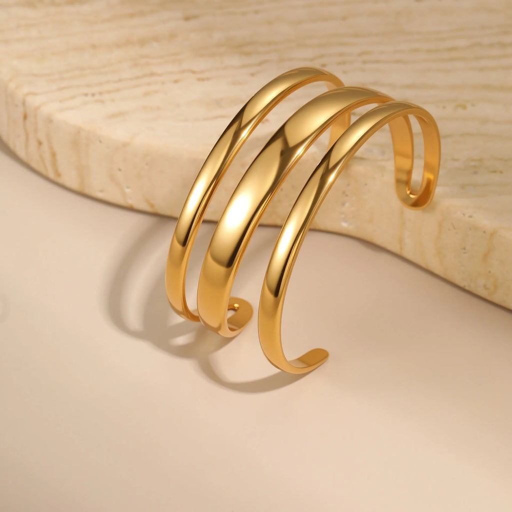 Women's geometric line bracelet in stainless steel with gold electroplating and simple opening