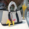 Women's canvas bucket tote bag with leather details in black, brown, gray, or red colours
