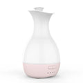 White or pink ultrasonic humidifier and essential oil diffuser vase with colourful LED night light.