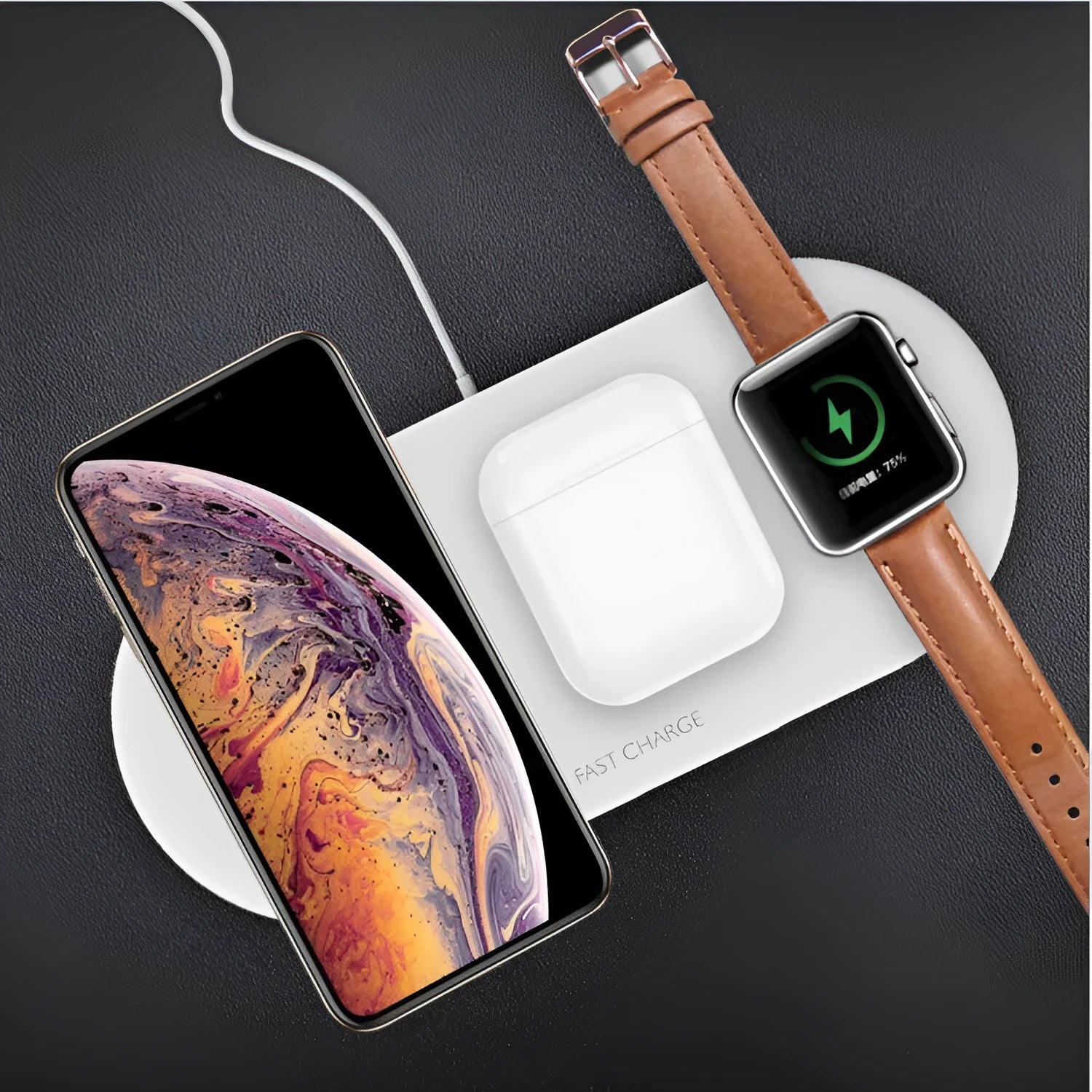 A black three-in-one desktop wireless charging station for an iPhone, an Apple Watch, and wireless headphones.