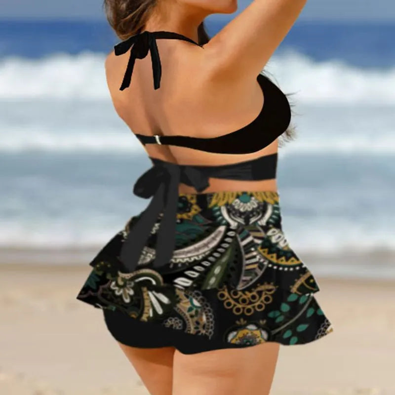 Women's purple bikini swimsuit with matching skirt showing lace-up detail and high waist briefs style