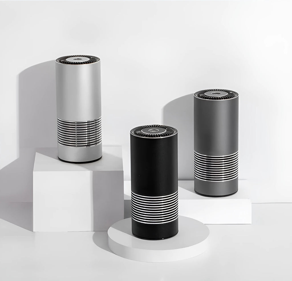 Compact cylindrical car air purifier in metallic grey showing 65mm diameter, with USB power cable.