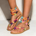 Ethnic style beaded petal floral sandals with artificial PU upper and round toe.