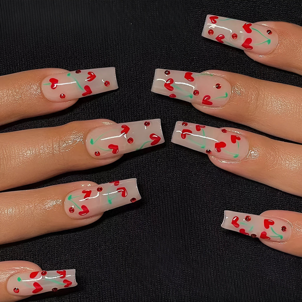 Set of 24 cherry blossom French manicure press-on nails with red diamond accents and glue tube