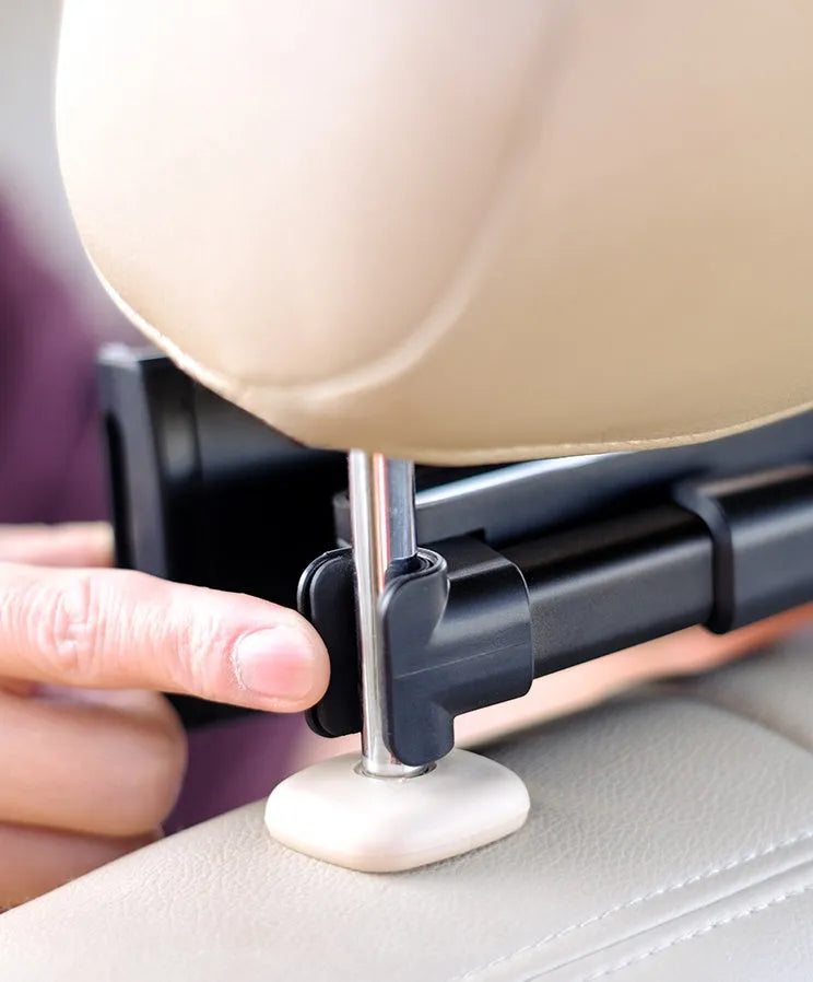 Black universal car phone holder mounted on a rear seat headrest, holding an iPad.