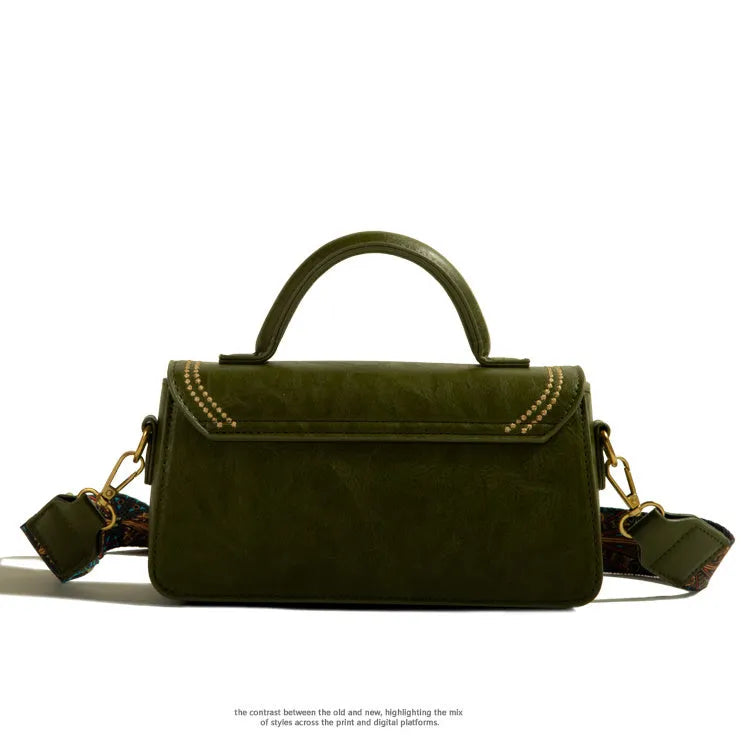 Brown retro messenger bag showing square vertical shape and internal organisation compartments